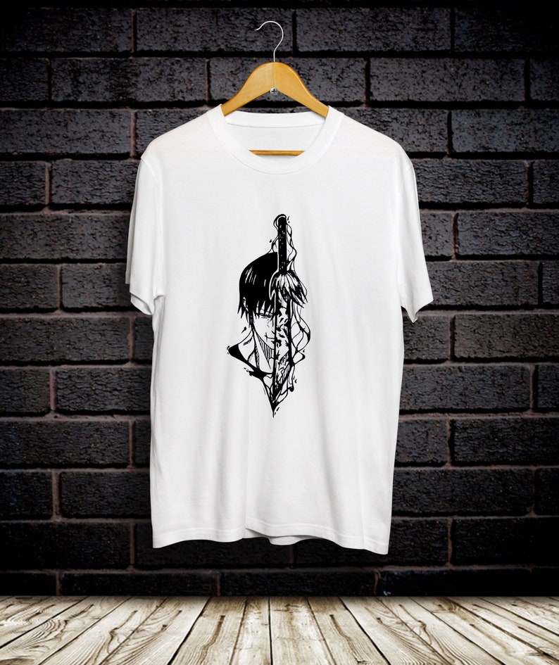 May include: White t-shirt with a black and white graphic print of a person with a sword.