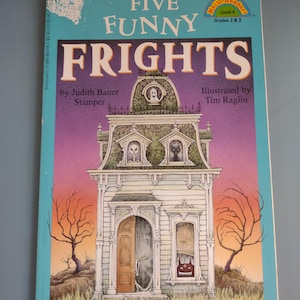 May include: A paperback book titled Five Funny Frights by Judith Bauer Stamper, illustrated by Tim Raglin. The cover features a white house with a ghost, a skeleton, a black cat, and a red monster in the windows, set against a purple sky.