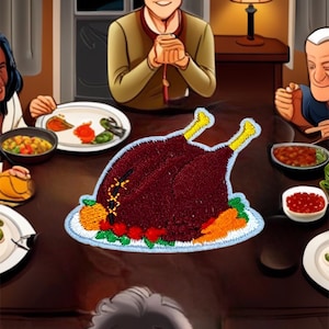 May include: A brown roasted turkey with yellow legs and a white plate with green and orange vegetables. The turkey is on a brown wooden table with a group of people sitting around it.