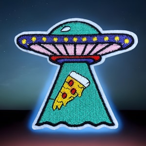 May include: A green and white embroidered patch of a flying saucer with a slice of pizza hanging from it against a dark blue starry background.