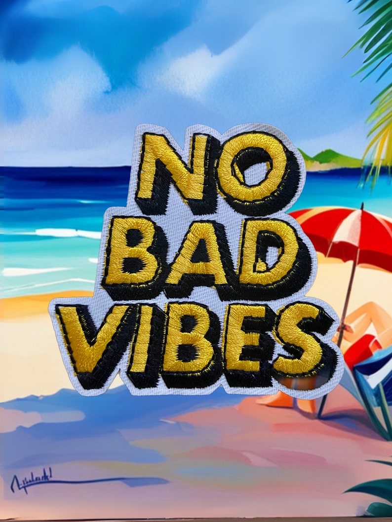 May include: A white patch with black and yellow embroidered text that reads "NO BAD VIBES". The patch is in front of a painting of a beach scene with a red umbrella and a person sitting on a beach chair.