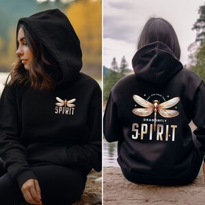 May include: Black hoodie with a dragonfly graphic and the text "Don't you have that dragonfly spirit" on the back. The front of the hoodie has a smaller dragonfly graphic and the text "spirit" underneath.