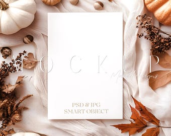 May include: A white rectangular card mockup with the word "MOCKUP" in a light color, surrounded by pumpkins, leaves, and decorative elements. The text "PSD & JPG SMART OBJECT" is also visible. The overall theme is autumn and fall.