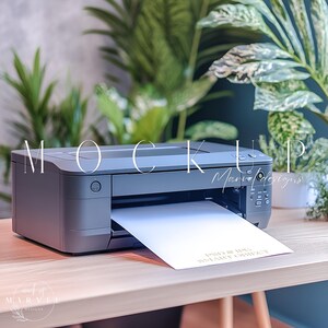 May include: A black printer with a white sheet of paper coming out of the paper tray. The paper has the text "PSD & JPG SMART OBJECT" printed on it. The printer is sitting on a wooden table.