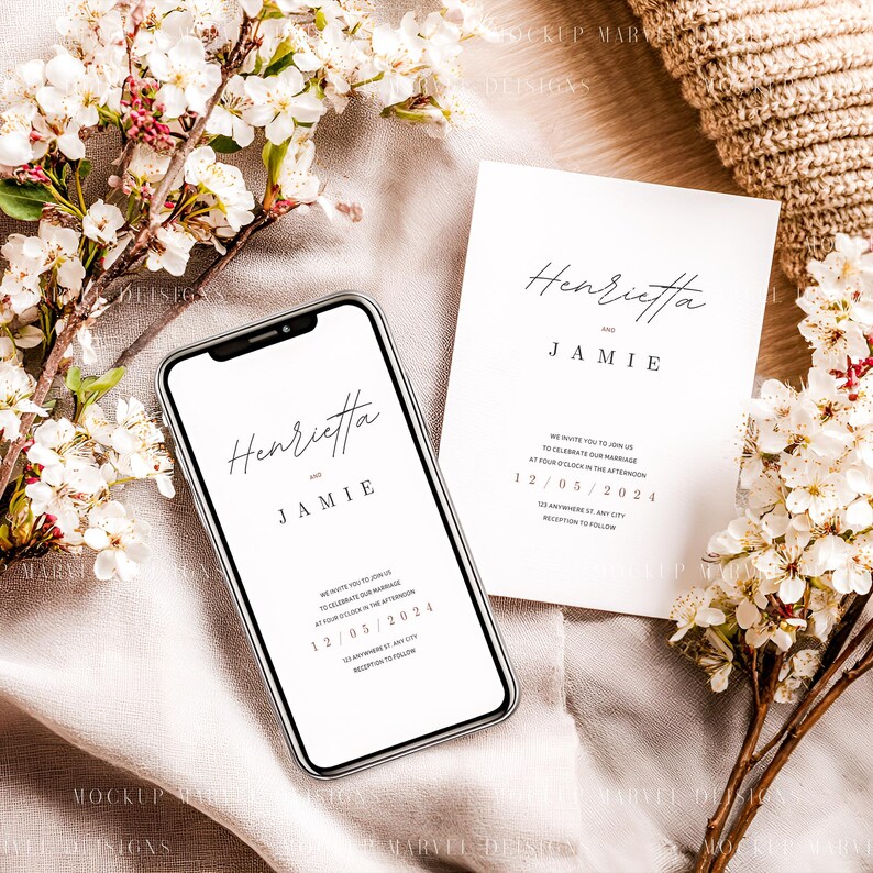 May include: A smartphone and invitation card with the names "Henrietta" and "Jamie" in elegant script. The invitation includes the date 12/05/2024. White flowers and a beige fabric create a soft, romantic setting, ideal for wedding announcements.