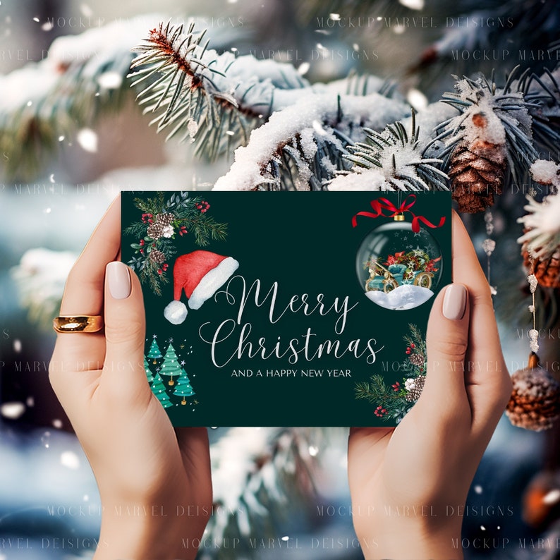 May include: A green Christmas card with a white background and the text "Merry Christmas and a Happy New Year". The card features a red Santa hat, a green pine tree, and a glass ornament with a winter scene.