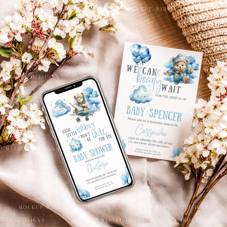May include: A baby shower invitation and a smartphone screen displaying a similar design. The invitation and phone screen feature a watercolor illustration of a teddy bear in a blue airplane, clouds, and text. The invitation reads "We can bearly wait for the arrival of Baby Spencer."