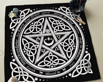 May include: Black fabric altar cloth with a white pentagram design and Celtic knot border. The text around the pentagram reads "Air Know Your Power Spirit Alway Be Kind Water Stay In Balance Fire Blessed Be" and the elements are listed around the circle.