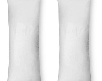 May include: Two white rectangular pillows, both are long and narrow, and are lying flat on a white background.