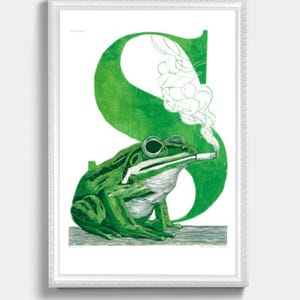 May include: Framed art print featuring a green frog smoking a cigarette, set against a large green letter "S". The frog is detailed with textured shading, and the smoke is depicted in wispy white lines. The artwork is framed in a white border.