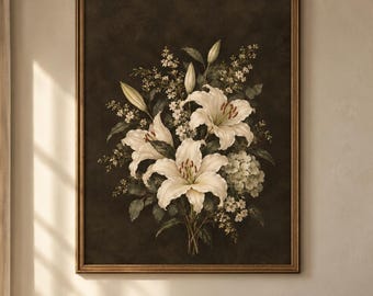 May include: A framed wall art print featuring a botanical illustration of white lilies and small white flowers against a dark, moody background. The artwork is enclosed in a thin, metallic gold frame, showcasing a detailed floral arrangement.