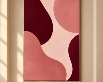 May include: A rectangular wall art piece featuring large, smooth, organic shapes in shades of deep burgundy, muted rose, and soft pale pink. The artwork is enclosed in a thin, metallic gold frame, creating a balanced composition of color.