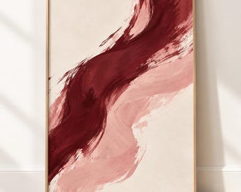 May include: A framed wall art print featuring a bold, diagonal brushstroke in deep burgundy and soft dusty rose against a neutral cream background. The artwork displays visible paint textures and fluid, sweeping motions across the rectangular canvas.