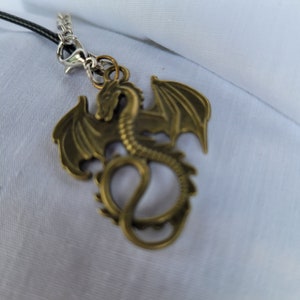 Gold dragon on black leather chain