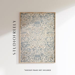 May include: A framed print featuring a detailed floral pattern in shades of blue and beige. The artwork has a vintage aesthetic, with the text "STUDIOFREELY" printed vertically on the left side. The phrase "*MOCKUP FRAME NOT INCLUDED" is at the bottom.
