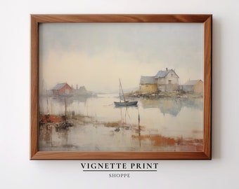 May include: A framed watercolor painting of a seascape with a small sailboat in the foreground and houses on the shore in the background. The sky is a soft blue and the water is a light blue with reflections of the houses and sky.