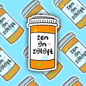 May include: A sticker of a pill bottle with the text "zen on zoloft" in colorful, handwritten letters. The bottle is orange with a white label and a black lid.