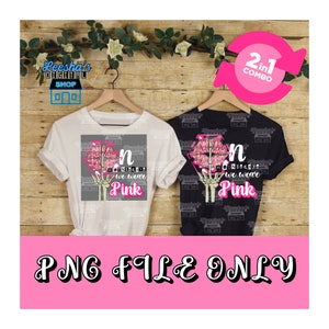 May include: Two t-shirt designs featuring a pink lips and skeleton hand graphic with the text "n we wear pink". The designs are shown on white and black t-shirts.
