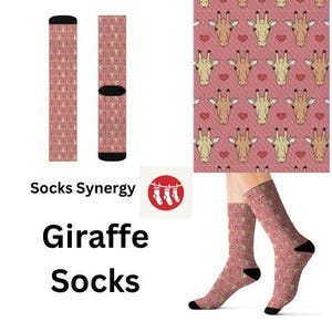 May include: Pink giraffe socks with a repeating pattern of giraffe heads and hearts. The socks have black heels and toes. The words "Socks Synergy" and "Giraffe Socks" are also in the image.
