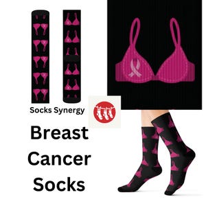 May include: Black socks with a pink bra pattern. The socks are displayed on a white background with the text "Socks Synergy" and "Breast Cancer Socks".
