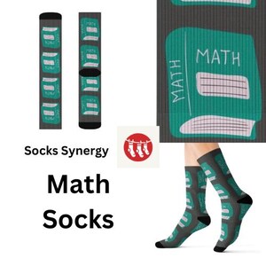 May include: Gray socks with a teal math book design. The socks feature the word "MATH" on a teal book graphic. The image also shows the text "Socks Synergy" and "Math Socks".