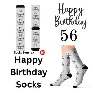 May include: White socks with black accents and the text "Happy Birthday 56" repeated vertically. The words "Happy Birthday" and the number "56" are also displayed in a larger font. The words "Socks Synergy" and "Happy Birthday Socks" are also displayed.