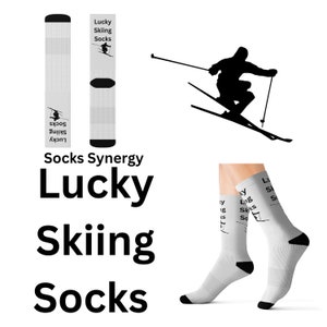 May include: White ski socks with black accents and the text "Lucky Skiing Socks." The socks feature a skier graphic. The image also shows a skier silhouette and the words "Socks Synergy."