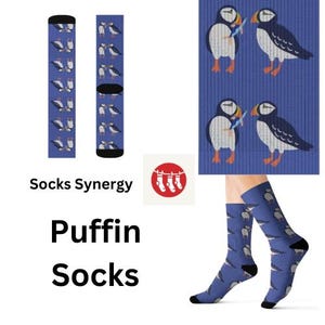 May include: Blue socks with a repeating pattern of puffin birds. The socks are displayed in multiple views, including a pair worn on feet. The text "Puffin Socks" is also visible.