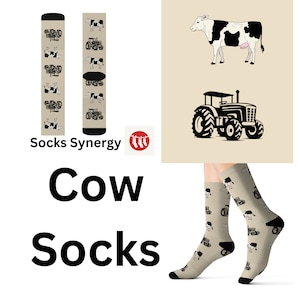 May include: Beige cow socks with black and white cow and tractor patterns. The words "Cow Socks" are in large, bold black letters. The brand name "Socks Synergy" is also visible in the image.