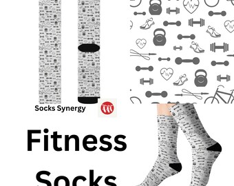 May include: Pair of fitness socks featuring a monochrome pattern of gym equipment, including dumbbells and kettlebells. The socks have black heels and toes. The words "Fitness Socks" are printed in large black letters.