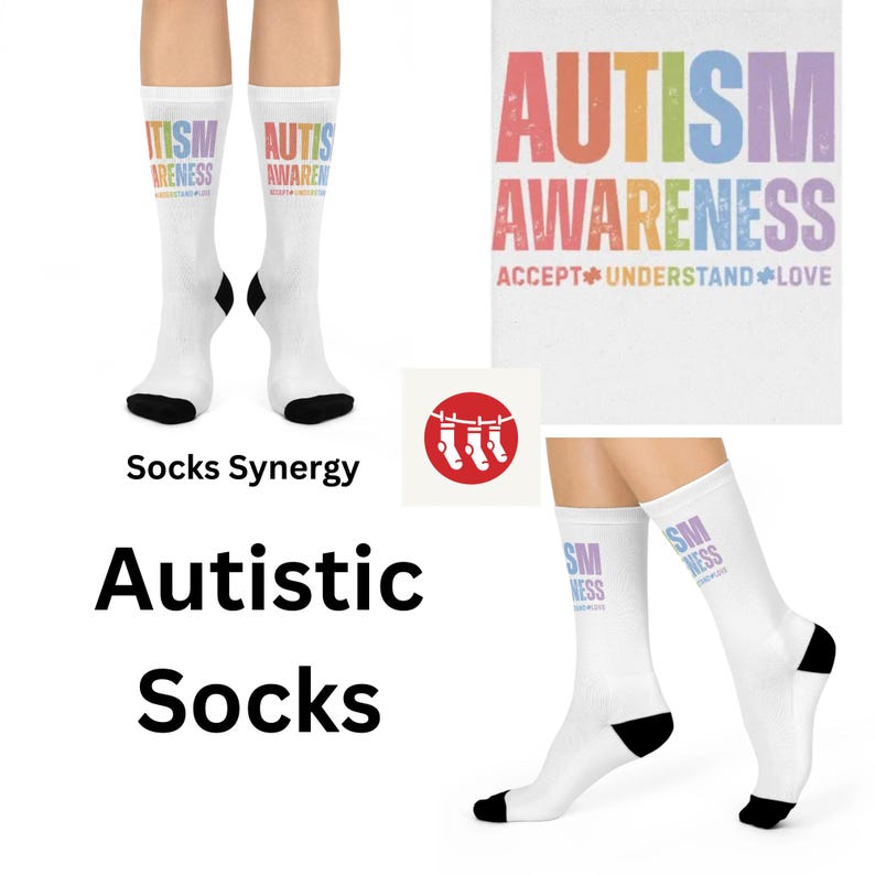 May include: A pair of white socks with the text "Autism Awareness Accept Understand Love" in rainbow colours. The socks are on a white background.