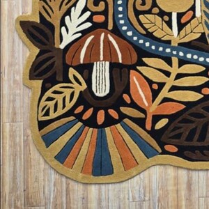 Artisan made wall rug featuring nature inspired motifs, hand tufted for texture-rich bohemian home decor.
