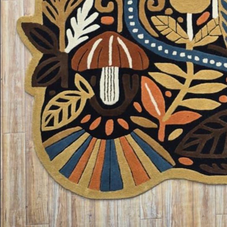 Artisan made wall rug featuring nature inspired motifs, hand tufted for texture-rich bohemian home decor.