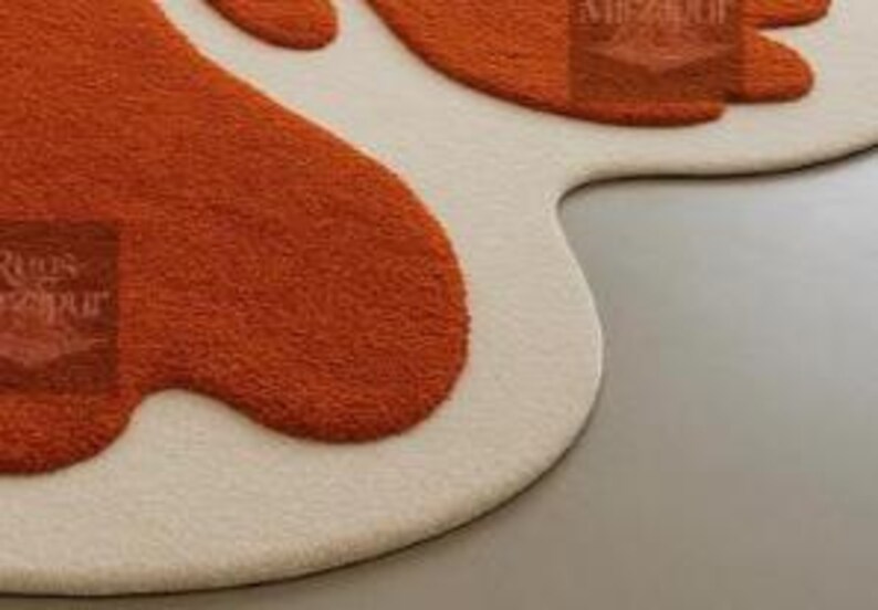 Funky 70s-inspired blob-shaped rug with high-low texture in open concept modern home interior.