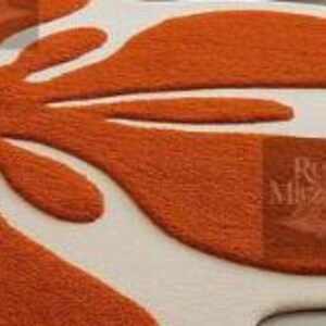 Large soft wavy rug centerpiece with playful organic shapes in vibrant tangerine and ivory tones.