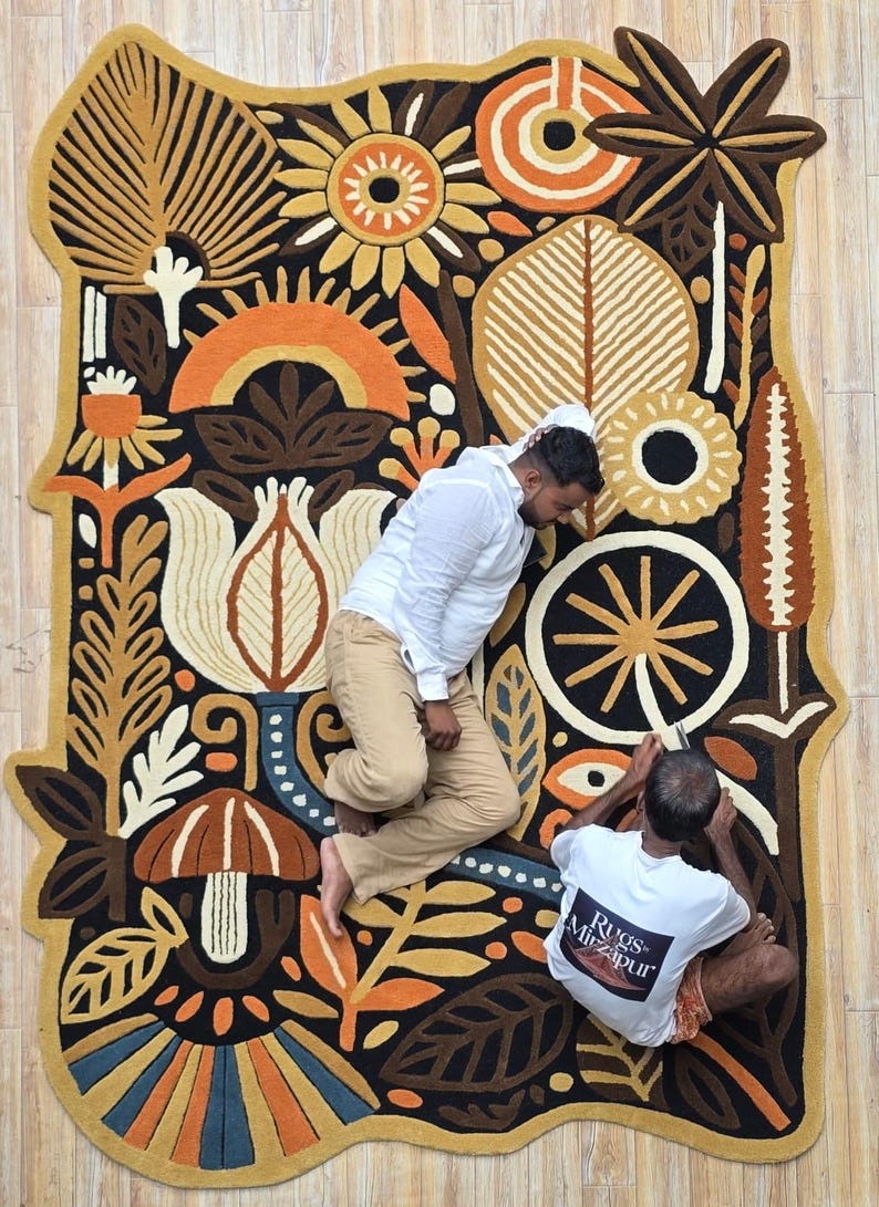 Statement textile wall art rug in organic shape, inspired by nature and folk illustration, perfect for boho and mid-century interiors.