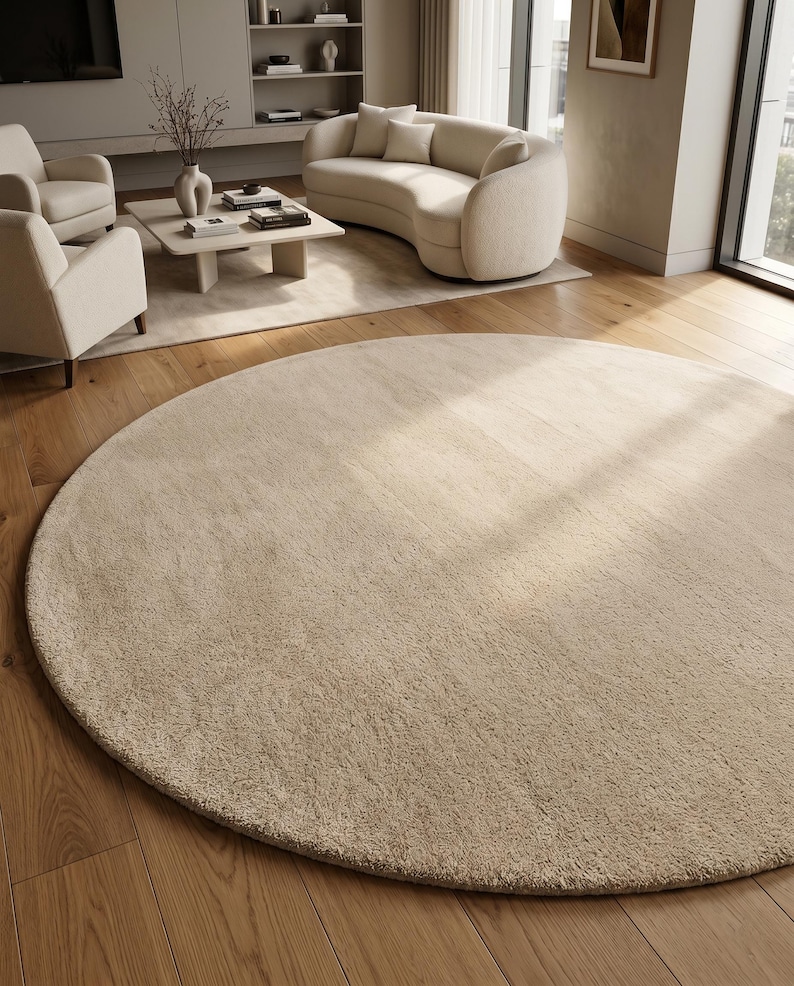 Sand beige hand tufted wool rug designed for upscale residential interiors featuring a rich plush texture and elegant monochromatic styling. Crafted from premium New Zealand wool, this custom area rug complements modern homes, luxury apartments, boutique hotels, designer residences, and carefully curated interior projects. Its versatile neutral palette integrates beautifully with contemporary furniture, architectural details, and natural décor elements.