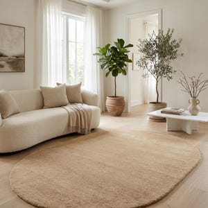 Custom size beige wool area rug available in rectangle, round, oval, and runner shapes for personalized interior design projects. Handmade from premium New Zealand wool, this luxurious rug features a dense plush pile and timeless sand beige color that enhances Scandinavian homes, minimalist interiors, designer apartments, and luxury residential spaces while offering exceptional comfort, durability, and artisan quality.