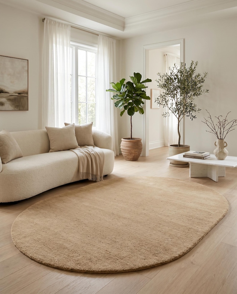 Custom size beige wool area rug available in rectangle, round, oval, and runner shapes for personalized interior design projects. Handmade from premium New Zealand wool, this luxurious rug features a dense plush pile and timeless sand beige color that enhances Scandinavian homes, minimalist interiors, designer apartments, and luxury residential spaces while offering exceptional comfort, durability, and artisan quality.