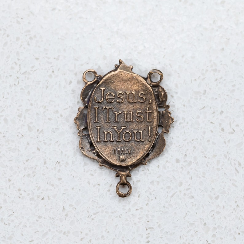 The back of the Divine Mercy center has the words "Jesus I Trust in You!" and is stamped "Italy"