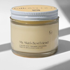 May include: A glass jar with a white lid containing a yellow cream. The label reads "My Skin's Best Friend A Tallow Spot Treatment for Eczema, Sensitive Skin, & Everything Else".