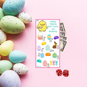May include: A colorful game board with a cartoon chick holding a knife. The board has a title that says "Hippity Hoppity Don't Touch My Property". The board has a variety of Easter-themed images, including eggs, jelly beans, and a chocolate bunny. The board also has a price for each image. The board is on a pink background.