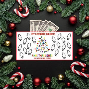 May include: A festive Christmas-themed game board with the text "MY FAVORITE COLOR IS CHRISTMAS LIGHTS ROLL A DICE & SAVE THE PRICE". The board features a Christmas tree made of colorful lights and dollar bills.