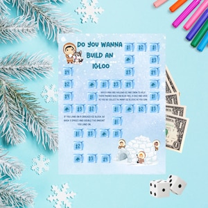 Puede incluir: Un tablero de juego azul y blanco con el texto "Do you wanna build an Igloo?" Los jugadores tiran un dado y recogen bloques de hielo para construir un iglú. El tablero de juego presenta una ilustración de dibujos animados de un iglú con personas construyéndolo.