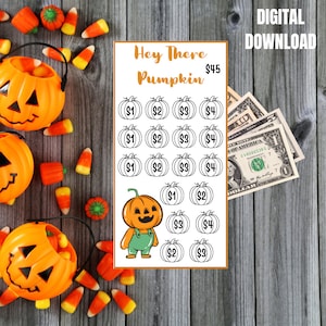 May include: A Halloween-themed digital download featuring a savings tracker with a pumpkin graphic and the text "Hey There Pumpkin". The image includes dollar bills, candy corn, and orange pumpkin buckets.