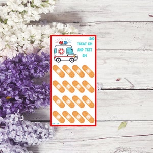 May include: A rectangular card with a red border features an ambulance illustration and the text "TREAT EM AND YEET EM". Below are 12 bandage illustrations, each with a dollar amount. The background includes white and purple flowers on a white wooden surface.