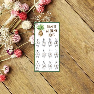 May include: A set of 12 stickers featuring a cartoon character with the text "Blame it all on my roots". The character is a green plant with a brown root system. The stickers are numbered 1 through 4.