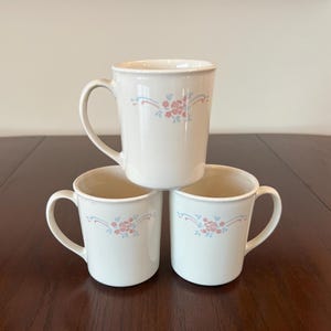 Corning - English Breakfast - Mugs/Cups - 3 7/8” tall - Lot of 3 - Ear shaped handle - Pink Floral w/ Blue Leaves - Vintage Corelle