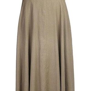 May include: A long, hooded cloak in a neutral tan color. The cloak has a full, flowing design and a large hood. The fabric appears to be a medium-weight material, suitable for cooler weather. The cloak is designed to be worn over other clothing.