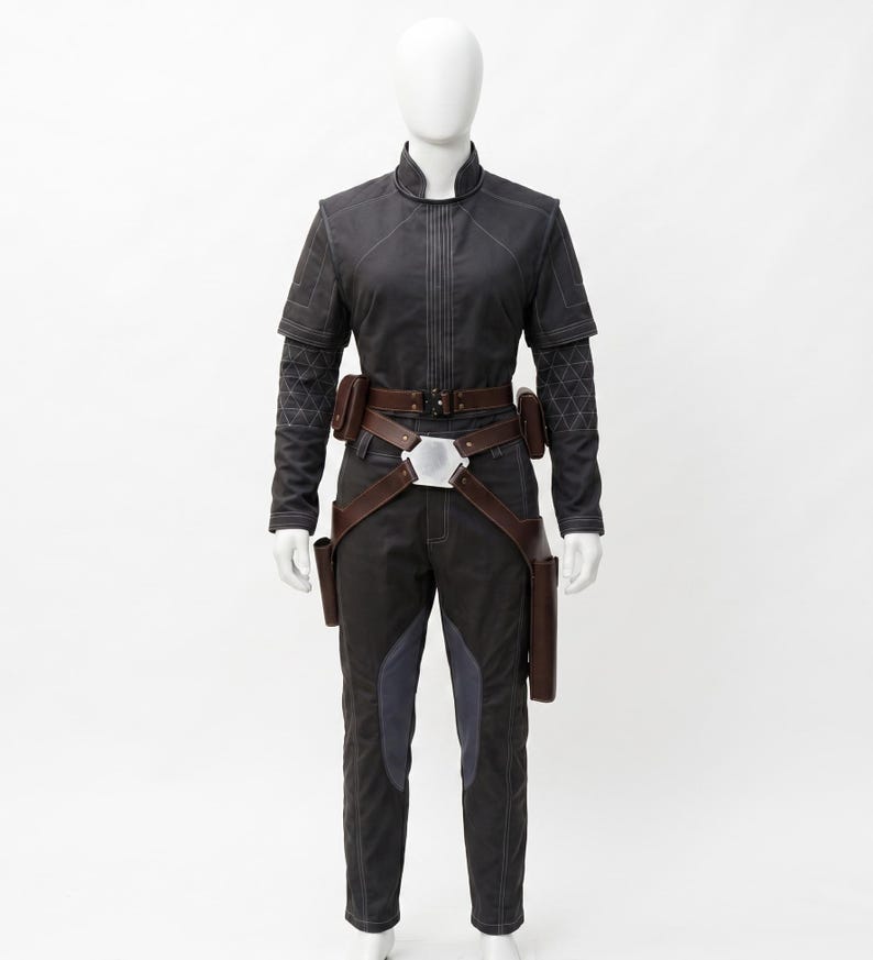 May include: A dark grey jumpsuit with a high collar, long sleeves, and a brown belt with pouches. The trousers have dark blue accents. The outfit is displayed on a mannequin.